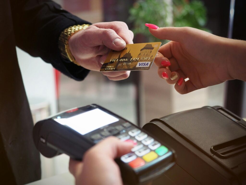 Close-up of a credit card payment being processed at a POS terminal.